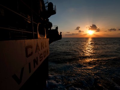 US Navy 120131-N-DR144-843 Seaman Matthew Haag stands watch as a lookout at sunset on the fantail aboard the Nimitz-class aircraft carrier USS Carl
