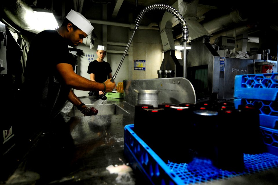 US Navy 120131-N-MD252-362 Sailors wash dishes in the scullery
