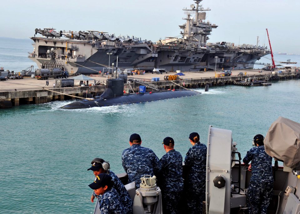 US Navy 120130-N-ED900-235 Cmdr. Benjamin Nicholson, executive officer of the guided-missile destroyer USS Pinckney (DDG 91), and watch standers on