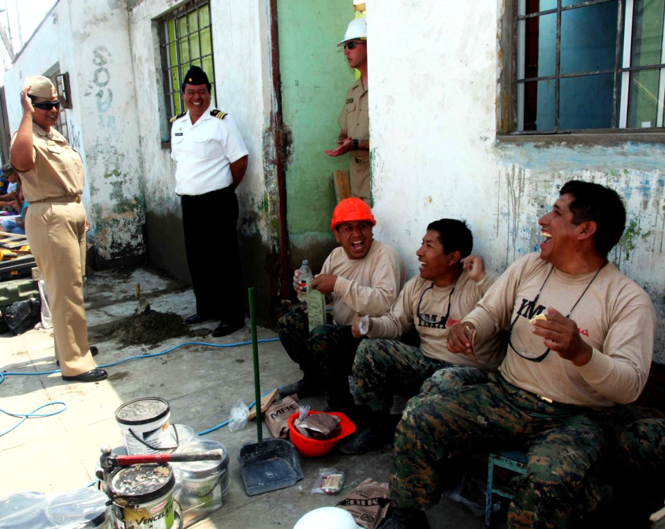 US Navy 120201-A-IP644-026 Peruvian navy Cmdr. David Bernal and Chief Logistic Specialist Olivia Sturgeon joke with Peruvian combat engineers on th
