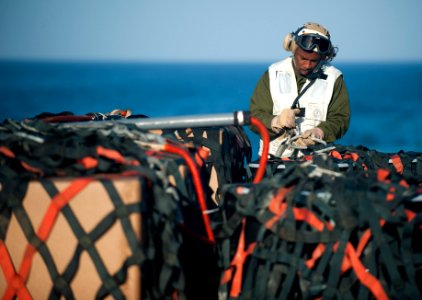 US Navy 120129-N-PB383-461 Master Sgt. Joseph Kelly prepares cargo for transfer on the flight deck of the amphibious transport dock ship USS New Or
