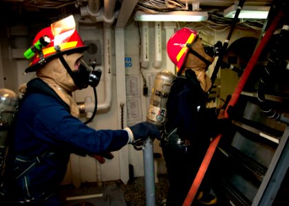 US Navy 120128-N-NL401-023 Sailors aboard the Arleigh Burke-class guided-missile destroyer USS James E. Williams (DDG 95) respond to a simulated fi