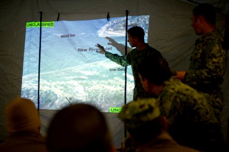 US Navy 120130-N-PC102-003 Lt. j.g. Sean Murphy, a patrol officer, assigned to Riverine Squadron (RIVRON) 2, conducts a pre-mission operations brie