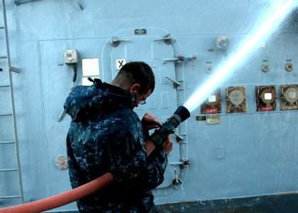 US Navy 120131-N-NL401-132 A Sailor aboard the Arleigh Burke-class guided-missile destroyer USS James E. Williams (DDG 95) participates in a fresh