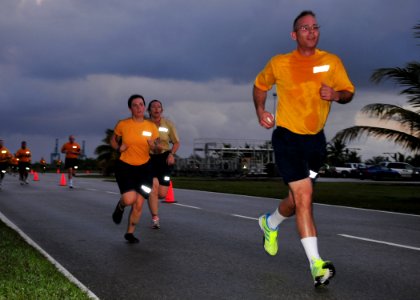 US Navy 120127-N-UE250-074 Sailors assigned to the submarine tender USS Emory S. Land (AS 39), run during the last leg or a command sponsored 5k ru