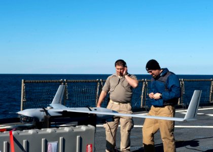 US Navy 120130-N-NR955-036 Contractors prepare the unmanned aerial vehicle Scan Eagle for take off on the flight deck aboard the Whidbey Island-cla