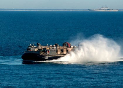 US Navy 120131-N-NL541-138 A landing craft air cushion (LCAC) from Assault Craft Unit (ACU) 4 returns to the amphibious assault ship USS Wasp (LHD