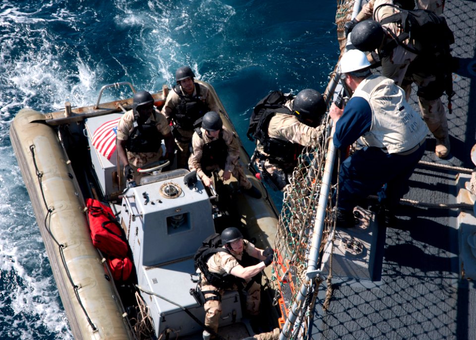 US Navy 120130-N-NL401-091 Sailors return to the Arleigh Burke-class guided-missile destroyer USS James E. Williams (DDG 95) after completing a vis