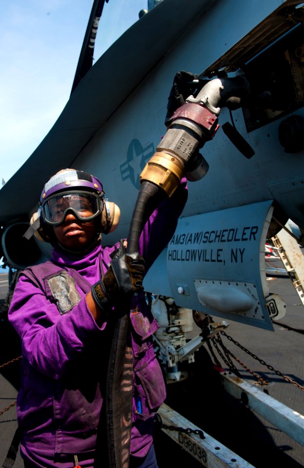US Navy 120202-N-OY799-024 Airman Recruit Chelsea Heard fuels an F-A-18C Hornet from the Golden Dragons of Strike Fighter Squadron (VFA) 192 on the