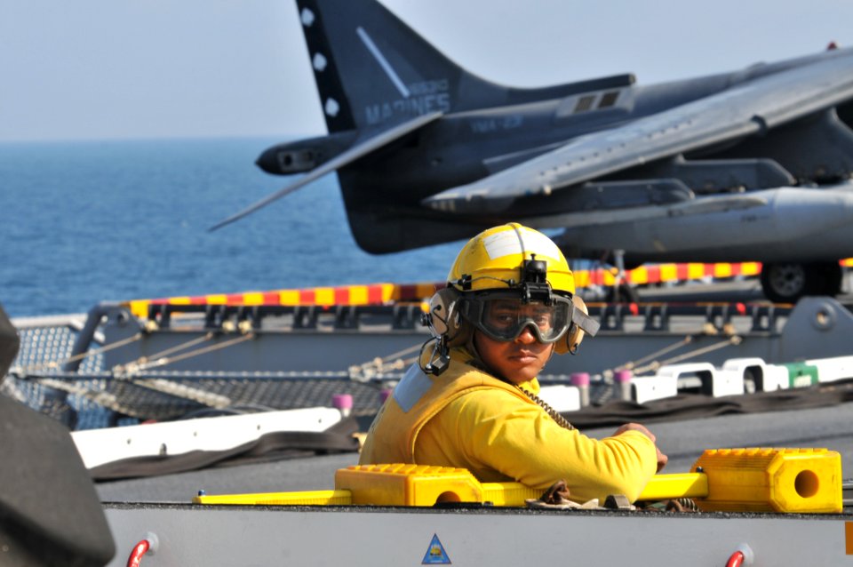 US Navy 120202-N-UM734-418 Aviation Boatswain's Mate (Handling) 3rd Class Seward Lott, from Katy, TX., drives a tow tractor on the flight deck of t