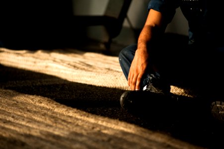 US Navy 120130-N-BT887-047 A Sailor prepares to handle line as part of a sea and anchor detail as the Nimitz-class aircraft carrier USS John C. Ste
