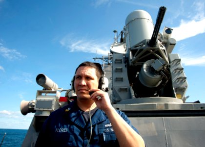US Navy 120131-N-NL401-195 Fire Controlman 1st Class David Flores conducts a pre-fire check with the close-in weapon system