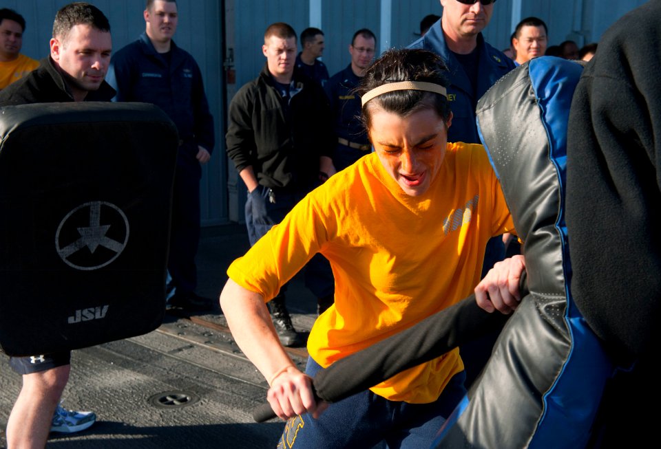 US Navy 120130-N-VY256-075 Lt. j.g. Rebecca Jackman executes a forward baton strike while under the effects of oleoresin capsicum spray during an a