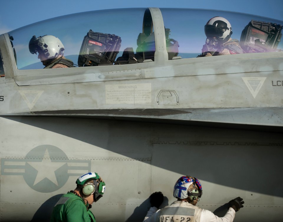 US Navy 120130-N-DR144-139 Pilots ready for launch in an F-A-18F Super Hornet assigned to Strike Fighter Squadron (VFA) 22 on the flight deck aboar