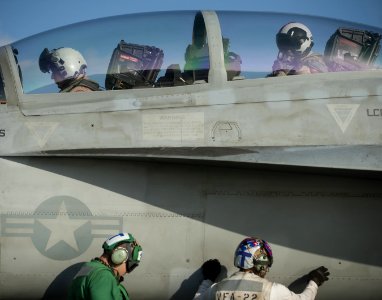 US Navy 120130-N-DR144-139 Pilots ready for launch in an F-A-18F Super Hornet assigned to Strike Fighter Squadron (VFA) 22 on the flight deck aboar