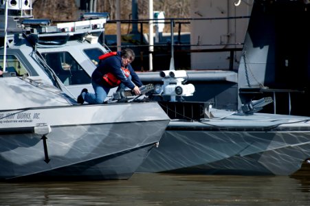 US Navy 120131-N-DU438-227 Seth Riley, supporting Naval Surface Warfare Center Combatant Craft Division (NSWC CCD), loads Venon V-10 warning muniti