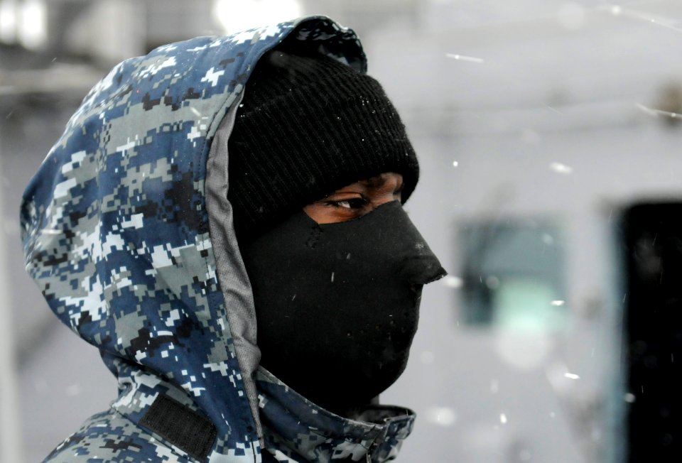 US Navy 120202-N-XG305-182 Seaman Cameron Stevens stands a low-visibility watch on the starboard bridge wing aboard the U.S. 7th Fleet flagship USS