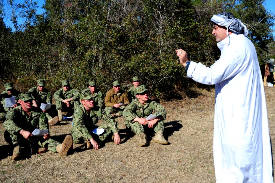US Navy 120130-N-QD416-057 Satar Alrubai, a subject matter expert with Defense Training Systems, conducts a cultural awareness class with members o