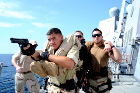 US Navy 120203-N-RP435-142 Sailors assigned to the visit, board, search, and seizure team of the guided-missile destroyer USS Halsey (DDG 97) demon photo