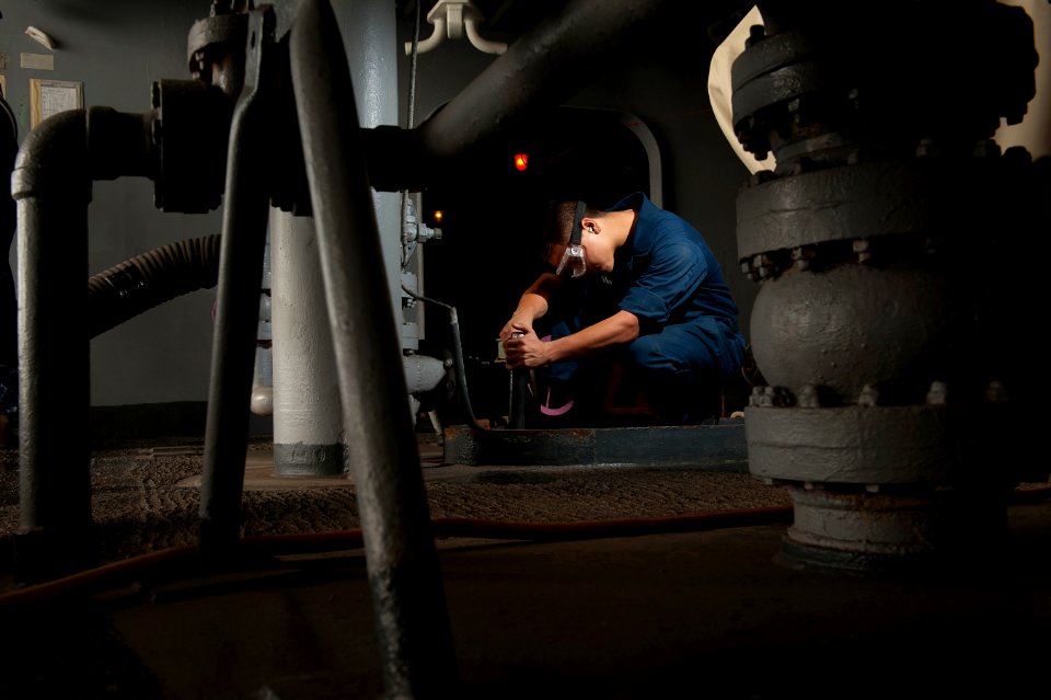 US Navy 120201-N-DR144-024 Seaman Nicolai Laguatan, assigned to the deck department aboard the Nimitz-class aircraft carrier USS Carl Vinson (CVN 7