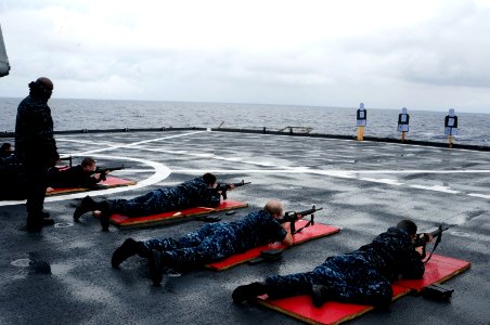 US Navy 120204-N-WV964-039 A Sailor observes Sailors during a small arms shoot
