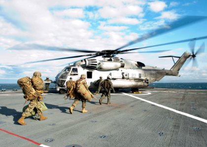 US Navy 120202-N-NR955-089 Marines assigned to the 24th Marine Expeditionary Unit (24th MEU) prepare to board a CH-53E Super Stallion helicopter as