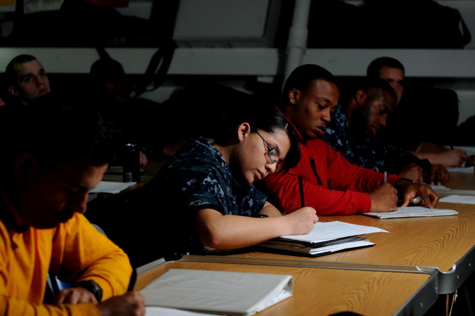 US Navy 120202-N-GZ832-017 Sailors take notes during an advanced damage control class aboard the Nimitz-class aircraft carrier USS Carl Vinson (CVN