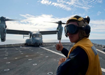 US Navy 120131-N-NR955-383 A Sailor gets instructions from the flight deck control tower