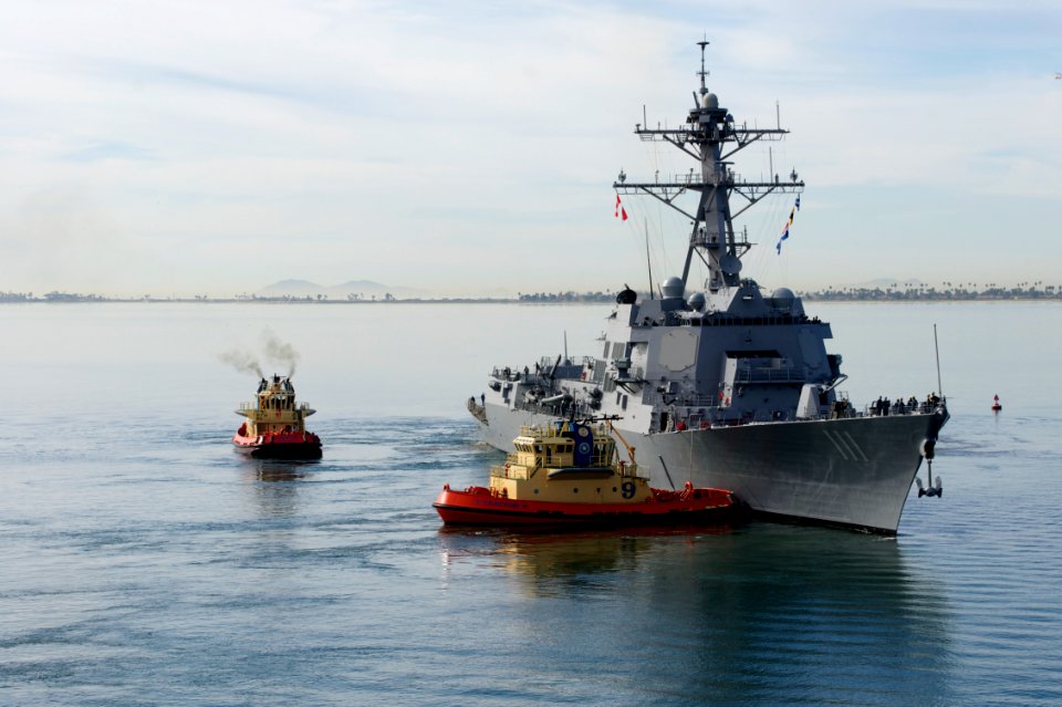US Navy 120206-N-ZC343-598 Tugboats assist the Arleigh Burke-class guided-missile destroyer USS Spruance (DDG 111) away from the pier as the ship d