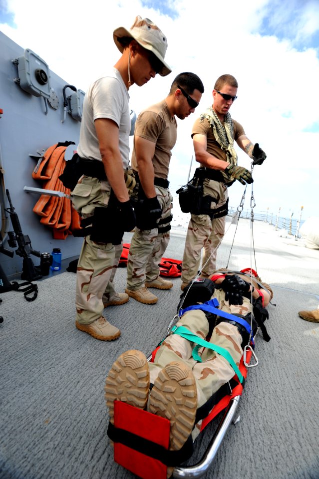 US Navy 120203-N-RP435-013 Sailors assigned to the visit, board, search, and seizure team of the guided-missile destroyer USS Halsey (DDG 97) learn photo