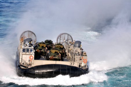 US Navy 120202-N-UM734-806 A landing craft air cushion approaches the welldeck of the amphibious assault ship USS Kearsarge (LHD 3) during Bold All photo