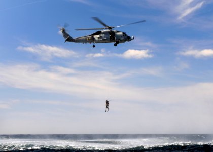 US Navy 120207-N-BC134-394 Sailors assigned to the guided-missile cruiser USS Bunker Hill (CG 52) are lifted into an SH-60B Sea Hawk helicopter dur