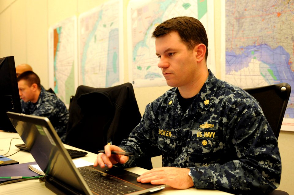 US Navy 120203-N-XR557-007 Lt. Cmdr. Matthew Tucker, operations officer at Naval Mine and Anti-Submarine Warfare Command, processes data during an