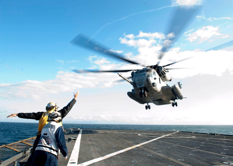 US Navy 120202-N-NR955-141 Sailors guide a CH-53E Super Stallion helicopter assigned to Marine Heavy Helicopter Squadron (HMH) 464 during a simulat