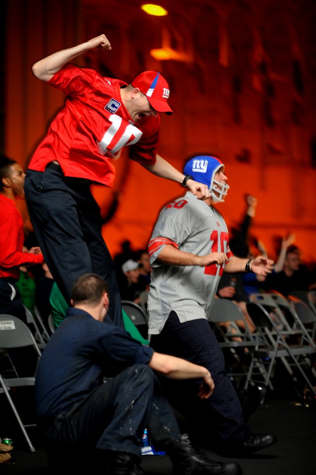 US Navy 120205-N-XE109-160 Sailors watch Super Bowl XLVI in the hangar bay of the aircraft carrier USS George H.W. Bush (CVN 77)