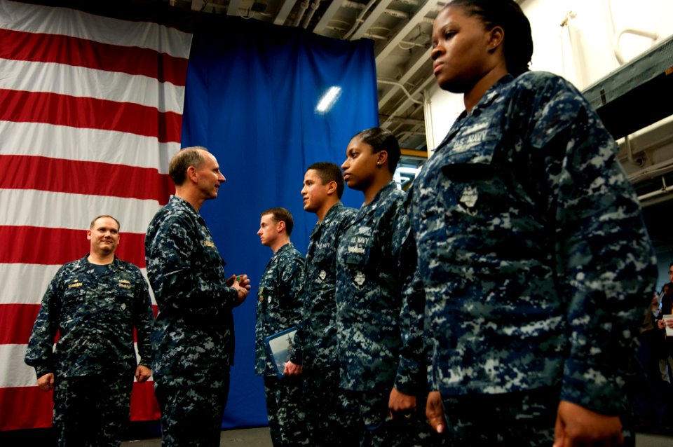 US Navy 120204-N-WS082-227 Chief of Naval Operations (CNO) Adm. Jonathan Greenert speaks with Sailors after holding a reenlistment ceremony aboard