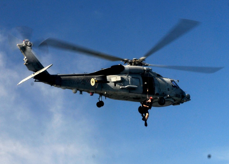 US Navy 120207-N-BC134-709 Sailors attached to the guided-missile cruiser USS Bunker Hill (CG 52) are lifted into an SH-60B Sea Hawk helicopter dur