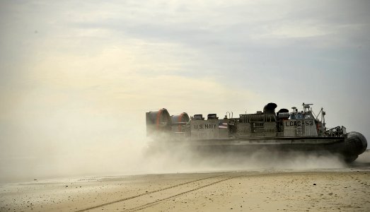 US Navy 120206-N-KB666-244 A landing craft air cushioned (LCAC) from the amphibious assault ship USS Kearsarge (LHD 3) comes ashore during an amphi