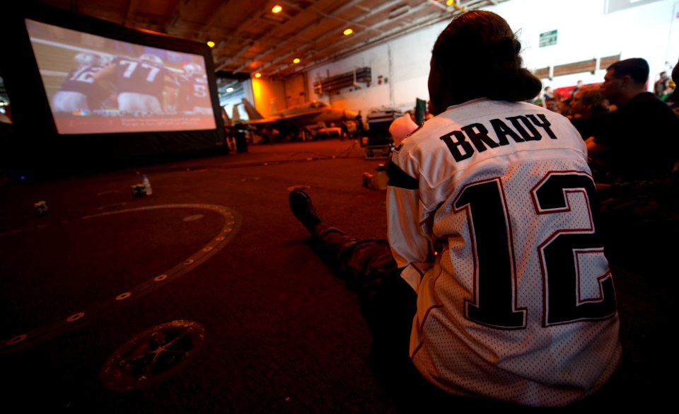 US Navy 120206-N-OY799-136 Aviation Boatswain's Mate (Equipment) Airman Charmeta Coble watches her team play during the Super Bowl party in the han