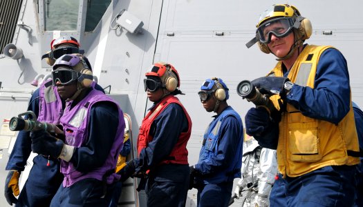 US Navy 120207-N-ZF681-077 Sailors simulate fighting a fire during a flight deck recovery drill aboard the guided-missile destroyer USS Halsey (DDG