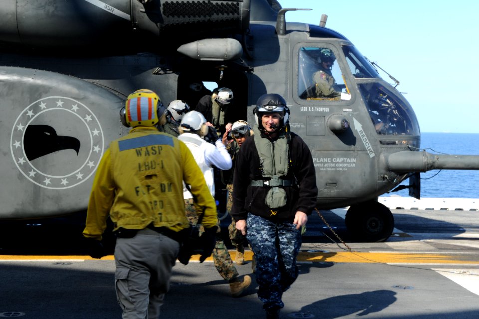 US Navy 120204-N-WL435-049 Chief of Naval Operations (CNO) Adm. Jonathan Greenert arrives aboard the amphibious assault ship USS Wasp (LHD 1) durin