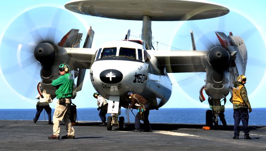 US Navy 120207-N-YB753-050 Sailors tie an aircraft to the flight deck photo