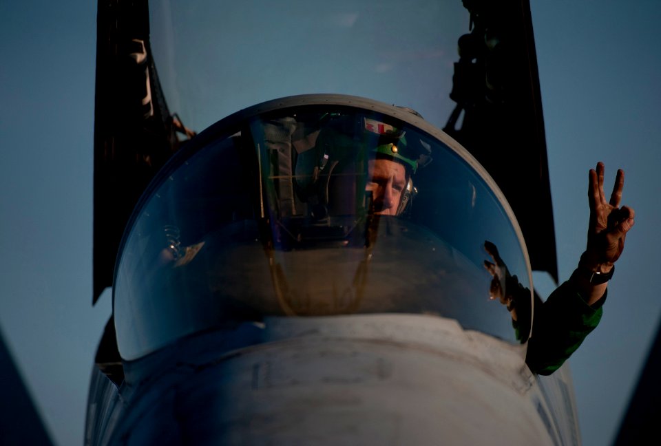 US Navy 120207-N-DR144-659 Aviation Structural Mechanic (Equipment) 2nd Class Jack McMurrain, assigned to Strike Fighter Squadron (VFA) 113, signal