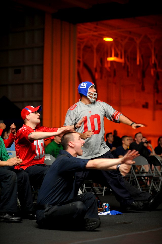 US Navy 120205-N-XE109-162 Sailors watch Super Bowl XLVI in the hangar bay of the aircraft carrier USS George H.W. Bush (CVN 77)