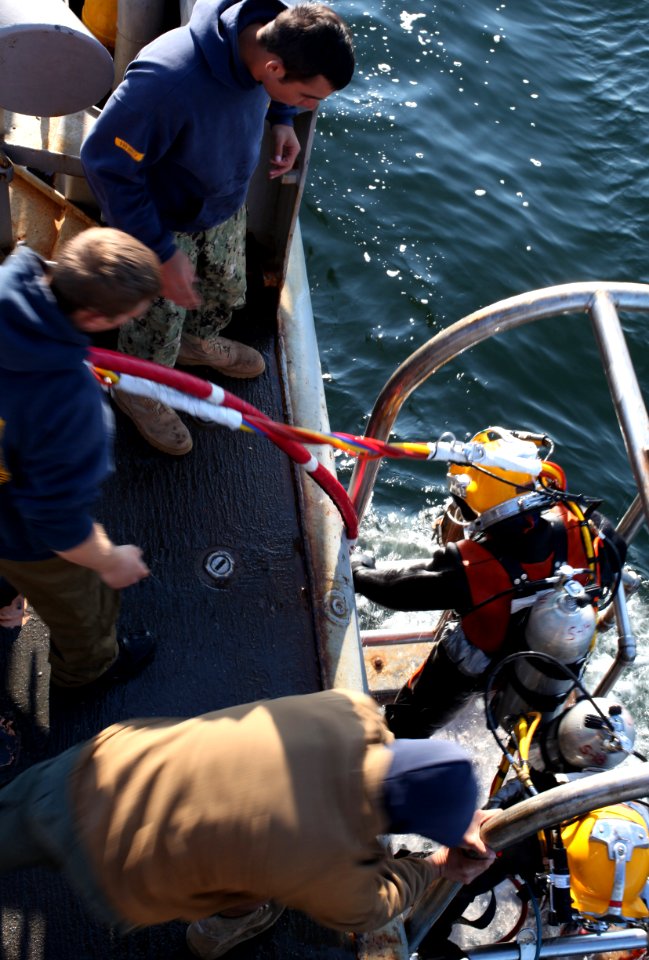 US Navy divers search for the remains of five un-accounted for service members from 1942 120728-N-OT964-160