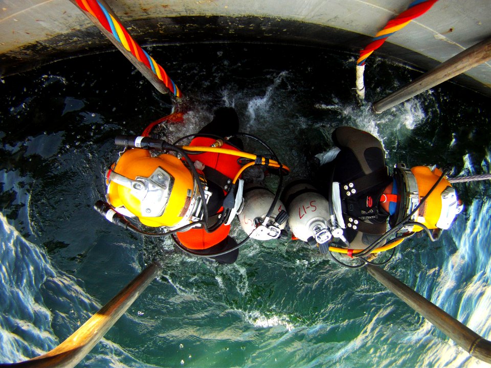 US Navy divers search for the remains of five unaccounted for service members from 1942 120720-N-OT964-178
