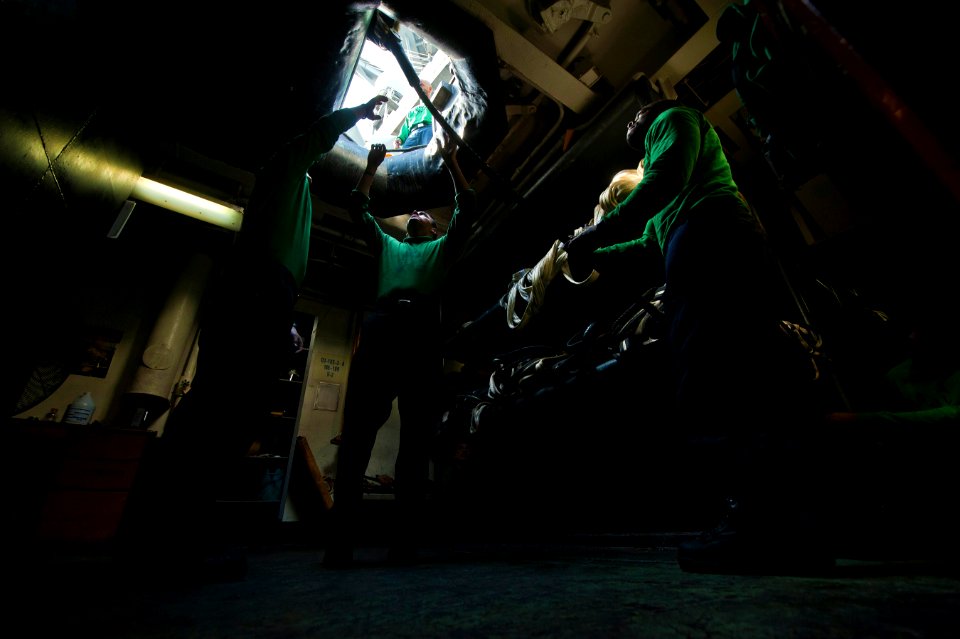 US Navy 120210-N-DR144-527 Sailors stow barricades below decks after flight deck drills aboard the Nimitz-class aircraft carrier USS Carl Vinson (C