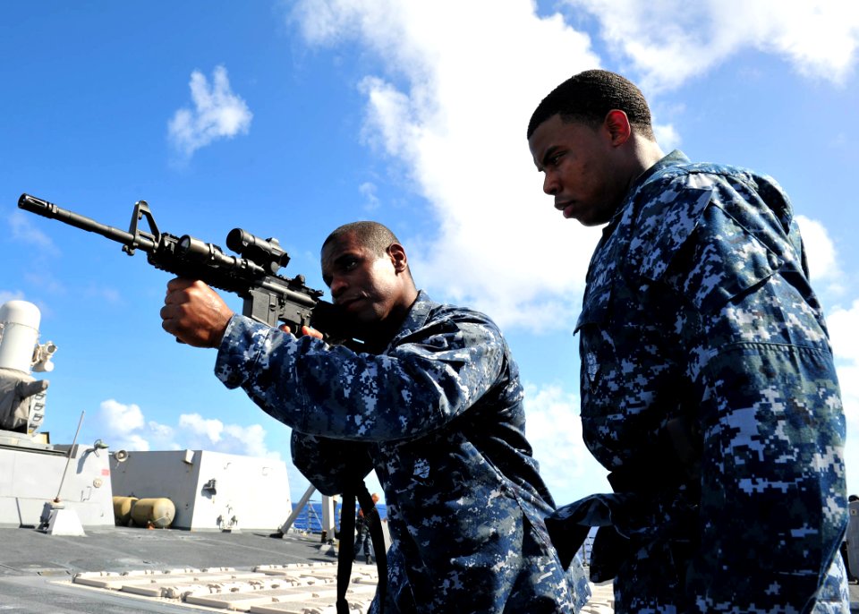 US Navy 120210-N-ED900-912 Personnel Specialist 1st Class Dwayne Smith, assigned to the guided-missile destroyer USS Pinckney (DDG 91), shows Opera