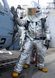 US Navy 120207-N-ZF681-306 Hull Maintenance Technician 3rd Class Christopher Mitchell checks an SH-60B Sea Hawk helicopter for hot spots during a f