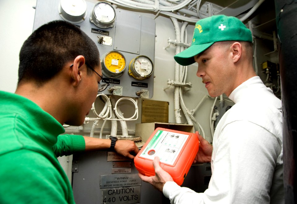 US Navy 120208-N-JN664-025 Chief Aviation Boatswain's Mate (Fuel) Richard Palmer performs a zone inspection aboard the Nimitz-class aircraft carrie